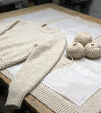 beige cashmere sweater on the operation counter