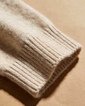 The high-quality ready-to-wear details of a flat cashmere sweater