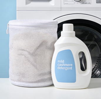 A mesh laundry bag, mild cashmere detergent, and a washing machine